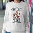 Never Underestimate An Old Lady Who Is Also A Nurse December Women Sweatshirt Funny Gifts