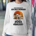 Never Underestimate An Old Woman Who Loves Dogs February Women Sweatshirt Personalized Gifts