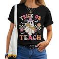 Trick Or Teach Groovy Teacher Halloween Retro Floral Ghost Women T-shirt
