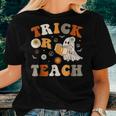 Trick Or Teach Groovy Halloween Retro Floral Ghost Teacher Women T-shirt Gifts for Her