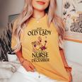 Never Underestimate An Old Lady Who Is Also A Nurse December Women's Oversized Comfort T-shirt Mustard