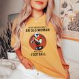 Never Underestimate An Old Woman Who Loves Football Women's Oversized Comfort T-shirt Mustard