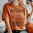 Never Underestimate An Old Lady Who Is Also A Nurse December Women's Oversized Comfort T-shirt Yam