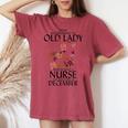 Never Underestimate An Old Lady Who Is Also A Nurse December Women's Oversized Comfort T-shirt Crimson