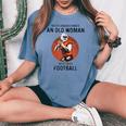 Never Underestimate An Old Woman Who Loves Football Women's Oversized Comfort T-shirt Blue Jean