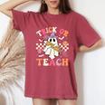 Trick Or Teach Groovy Teacher Halloween Retro Floral Ghost Women's Oversized Comfort T-Shirt Crimson
