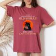 Never Underestimate An Old Woman Who Love Cats And Books Women's Oversized Comfort T-Shirt Crimson