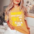 Never Underestimate A Girl With A French Horn Women's Oversized Comfort T-Shirt Mustard