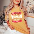 Never Underestimate A Woman Who Loves Yoga Women's Oversized Comfort T-Shirt Mustard