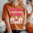Never Underestimate A Girl With A Camera Girl Photographer Women's Oversized Comfort T-Shirt Yam