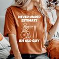 Never Underestimate An Old Guy Retired Old People Wheelchair Women's Oversized Comfort T-Shirt Yam
