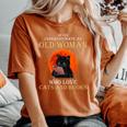Never Underestimate An Old Woman Who Love Cats And Books Women's Oversized Comfort T-Shirt Yam