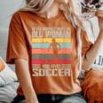 Vintage Never Underestimate An Old Woman Who Loves Soccer Women's Oversized Comfort T-Shirt Yam