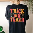 Groovy Trick Or Teach Halloween Teacher Life Girl Women's Oversized Comfort T-shirt Back Print Black