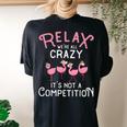 Relax Were All Crazy Its Not A Competition Flamingo Women's Oversized Comfort T-Shirt Back Print Black