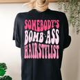 Somebodys Bomb Ass Hairstylist Groovy Hair Stylist Women's Oversized Comfort T-Shirt Back Print Black