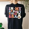In My Spooky Nurse Era Halloween Groovy Witchy Spooky Nurse Women's Oversized Comfort T-shirt Back Print Black