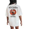 Never Underestimate An Old Woman Who Loves Football Women's Oversized Comfort T-Shirt Back Print Ivory