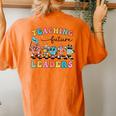 Retro Teaching Future Leaders Groovy Teacher Back To School Women's Oversized Comfort T-Shirt Back Print Yam