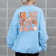 In My Spooky Teacher Era Ghost Halloween Retro Teachers Day Ghost Halloween Funny Gifts Women's Oversized Back Print Sweatshirt Light Blue
