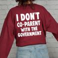 I Don’T Co-Parent With The Government Mom Dad Freedom Women's Oversized Sweatshirt Back Print Maroon