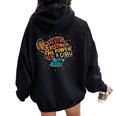 Never Underestimate The Power Of A Girl With Book Feminist Women Oversized Hoodie Back Print Black