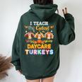 I Teach The Cutest Daycare Turkeys Thanksgiving Day Teacher Women Oversized Hoodie Back Print Forest