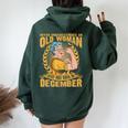 Never Underestimate An Old Woman Who Born In December Women Oversized Hoodie Back Print Forest