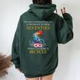 Never Underestimate Woman In Her Seventies Rides A Bicycle Women Oversized Hoodie Back Print Forest