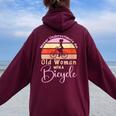 Never Underestimate An Old Woman With A Bicycle Lovers Women Oversized Hoodie Back Print Maroon
