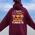 I Teach The Cutest Daycare Turkeys Thanksgiving Day Teacher Women Oversized Hoodie Back Print Maroon