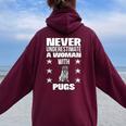 Never Underestimate A Woman With Pugs Women Oversized Hoodie Back Print Maroon