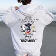Never Underestimate An Old Lady Who Loves Dogs-November Women Oversized Hoodie Back Print White