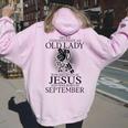 Never Underestimate An Old Lady Believes In Jesus September Women Oversized Hoodie Back Print Light Pink
