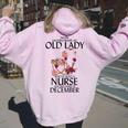 Never Underestimate An Old Lady Who Is Also A Nurse December Women Oversized Hoodie Back Print Light Pink