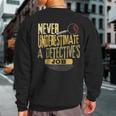 Never Underestimate A Detective's Job Sweatshirt Back Print
