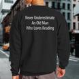 Never Underestimate An Old Man Who Loves Reading Sweatshirt Back Print